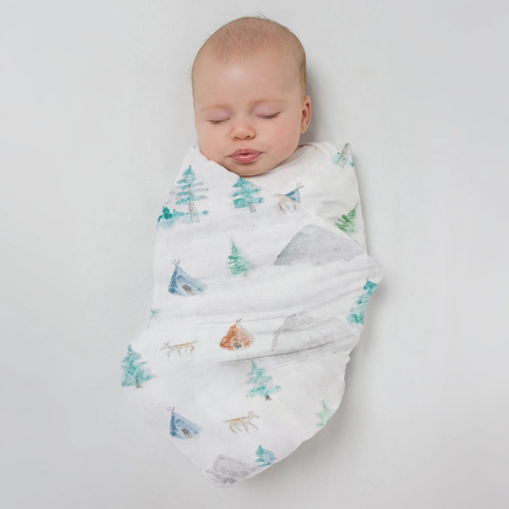 Muslin Swaddle   Pajama Gown   Hat Newborn Gift Set - Watercolor Mountains & Trees Muslin Blanket   Heathered Denim Hat   Pajama Gown