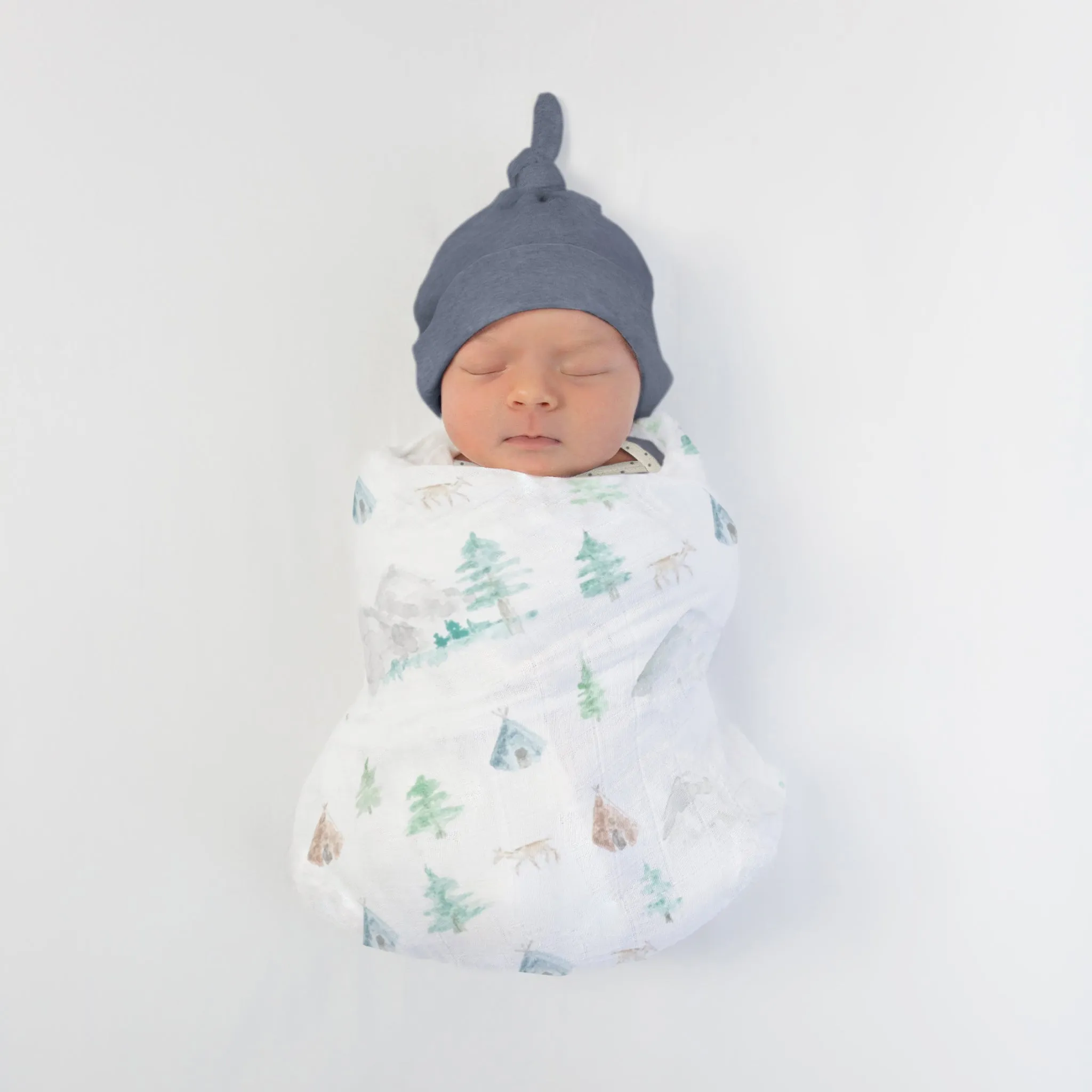 Muslin Swaddle   Pajama Gown   Hat Newborn Gift Set - Watercolor Mountains & Trees Muslin Blanket   Heathered Denim Hat   Pajama Gown