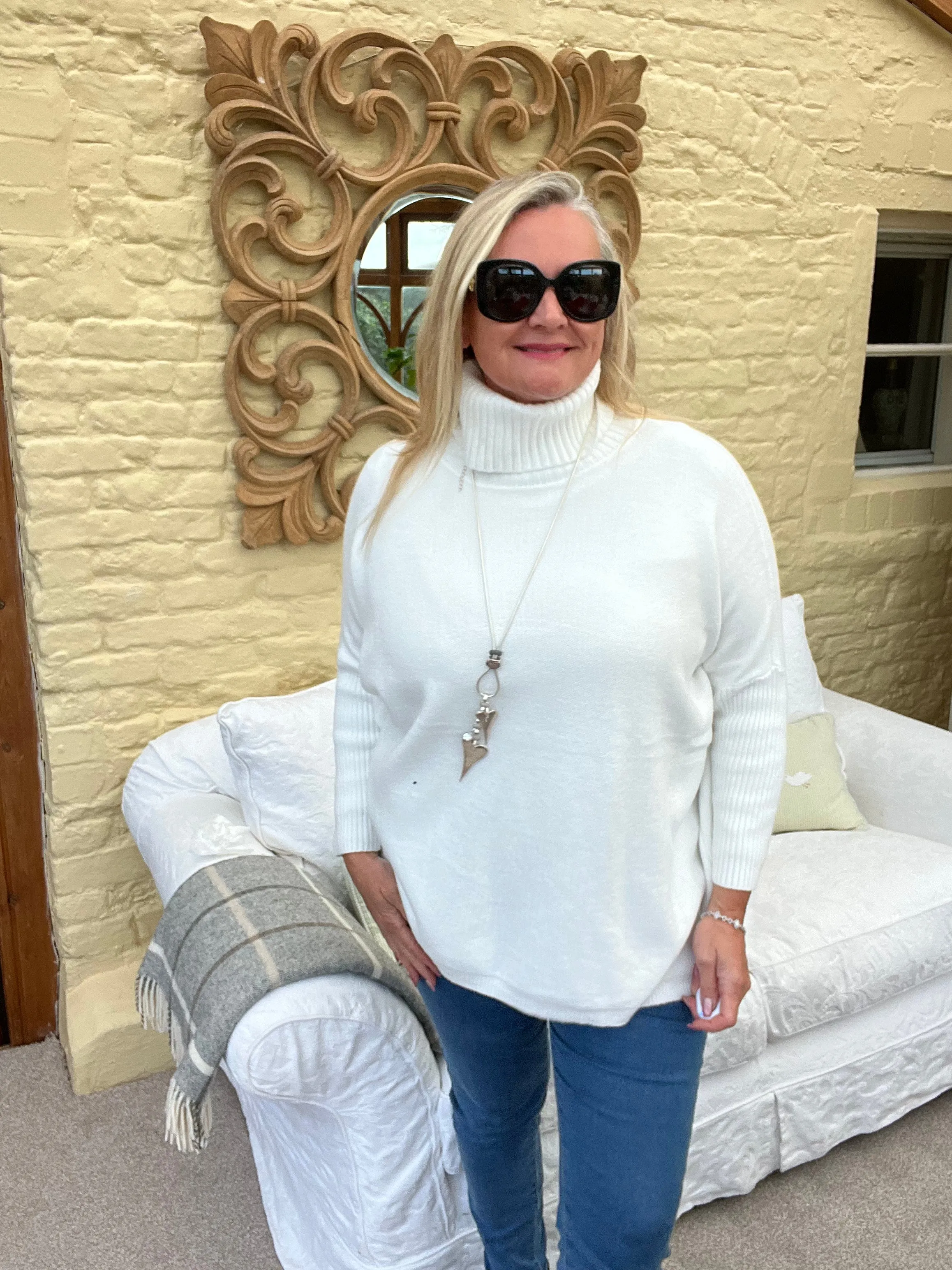 Rolled Neck Relaxed Style Jumper In Winter Cream